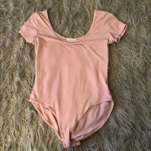 A light pink bodysuit